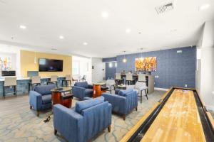Apartments in Limerick, Pennsylvania - Clubhouse with Seating Areas Shuffleboard and Arcade Games