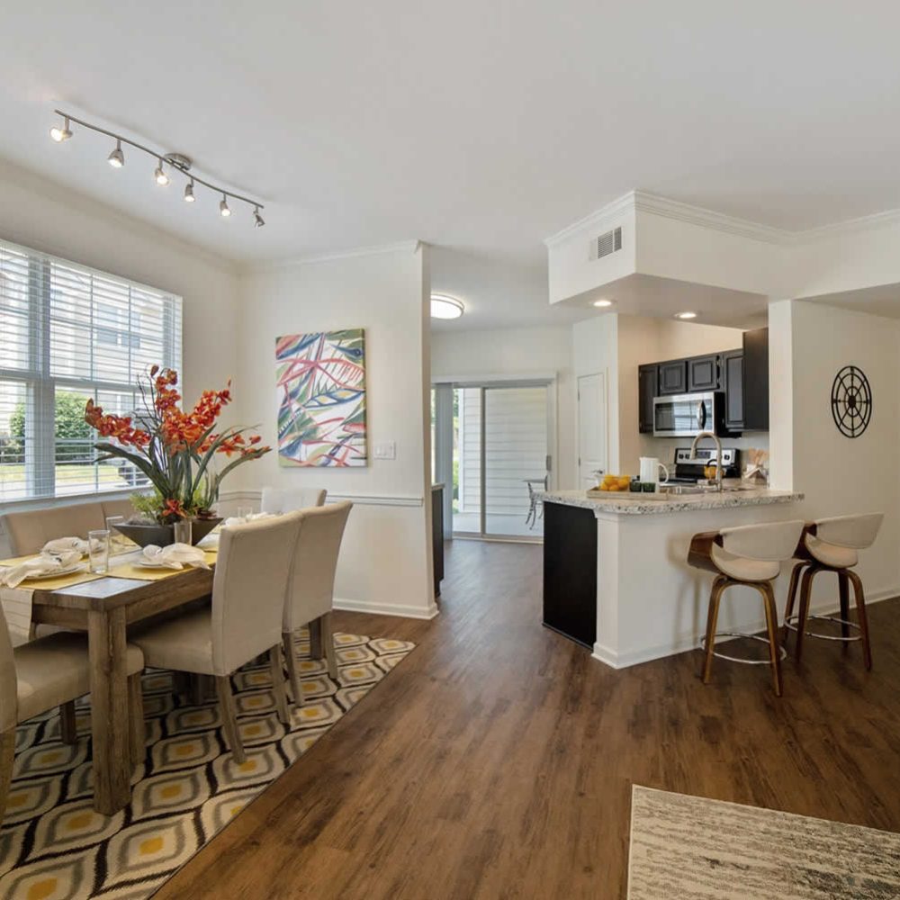 A kitchen and dining area in a large apartment.